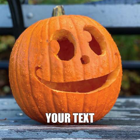 Carved pumpkin with a smiling face sitting on a wooden surface with text below.